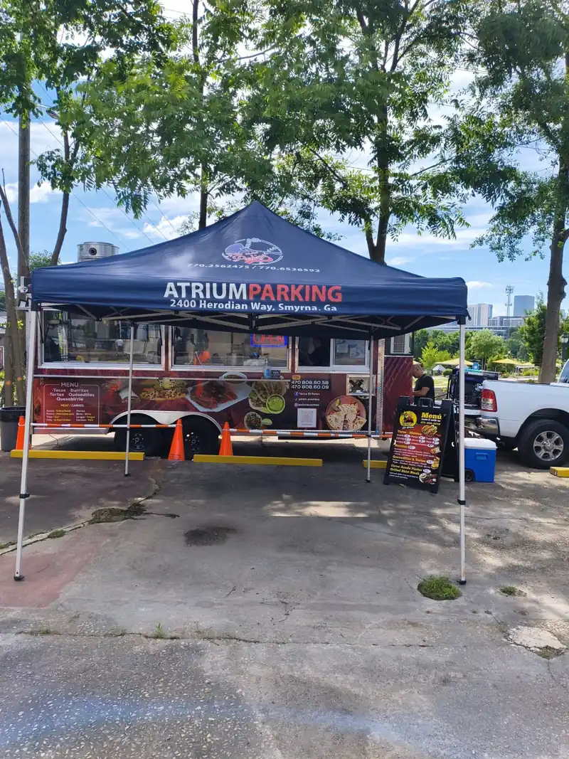 Grand Slam Parking attendant tent at the lot entrance